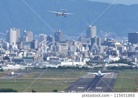 Bird's-eye view of Osaka Airport Airplanes taking off and landing 115651868
