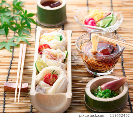 Somen noodles served on natural bamboo, a summer image Somen noodles served on natural bamboo, a summer image 115652492