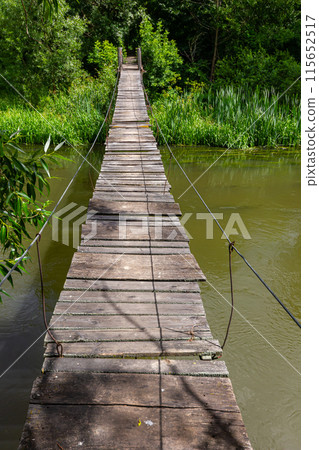 Suspension bridge, walkway to the adventurous, cross to the other side Suspension bridge, walkway to the adventurous, cross to the other side 115652517
