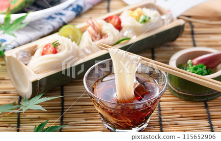 A summer tradition: dipping somen noodles in sauce 115652906