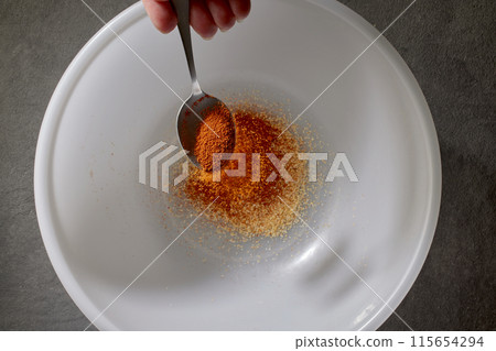 spoon of ground dried paprika spice spoon of ground dried paprika spice 115654294