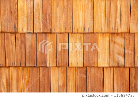 Wooden shingle roof tile texture, rustic construction for roof or exterior wall. Wooden shingle roof tile texture, rustic construction for roof or exterior wall. 115654753