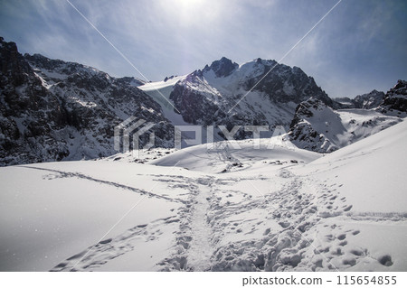 Hiking trail from the Talgar Pass towards the Bogdanovich glacier, the amazing nature of Central Asia in the mountains of Kazakhstan. Hiking trail from the Talgar Pass towards the Bogdanovich glacier, the amazing nature of Central Asia in the mountains of Kazakhstan. 115654855