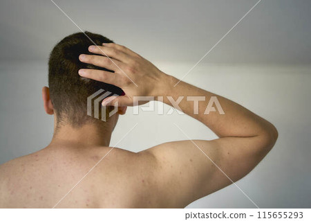 shoulder of a thirty-year-old man of medium build 115655293