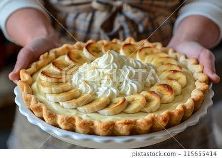 Handcrafted banana cream pie with caramelized bananas and a lush whipped topping Handcrafted banana cream pie with caramelized bananas and a lush whipped topping 115655414