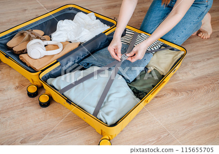 Hand, woman and suitcase for travel, adventure and holiday before leaving for vacation Hand, woman and suitcase for travel, adventure and holiday before leaving for vacation 115655705