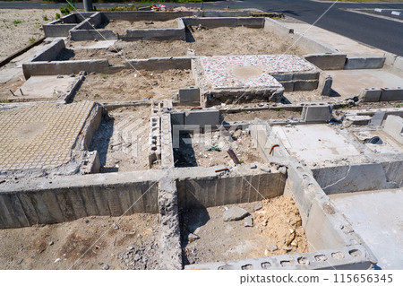 Remains of foundations of houses that were evacuated to make way for road widening 115656345