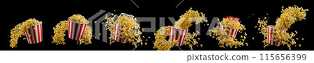 Flying popcorn from striped bucket isolated on black background 115656399