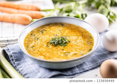 Egg and carrot soup in a bowl. Traditional Slovak egg and carrot soup 115656449