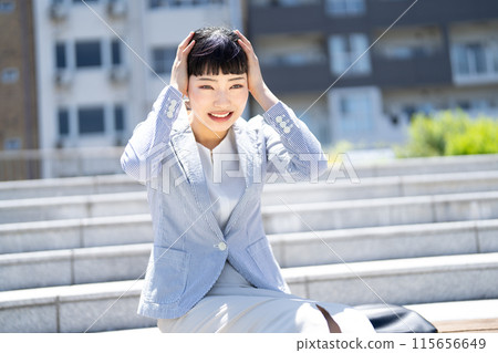 Depressed business woman 115656649