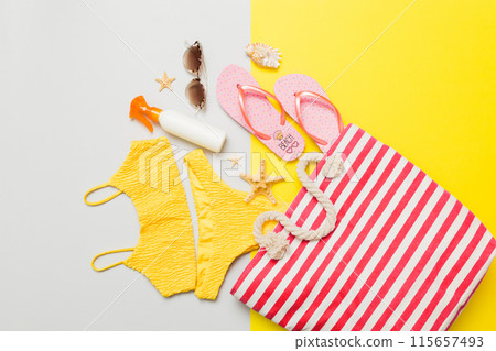 Composition with stylish beach accessories on colored background, top view. Beach fashion flat lay, summer concept. Trendy colors Composition with stylish beach accessories on colored background, top view. Beach fashion flat lay, summer concept. Trendy colors 115657493
