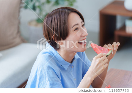 Woman eating watermelon (summer, food) Woman eating watermelon (summer, food) 115657753