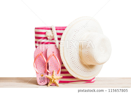 Stylish bag with beach accessories . Summer holiday concept. beach bag with straw hat with space for text 115657805