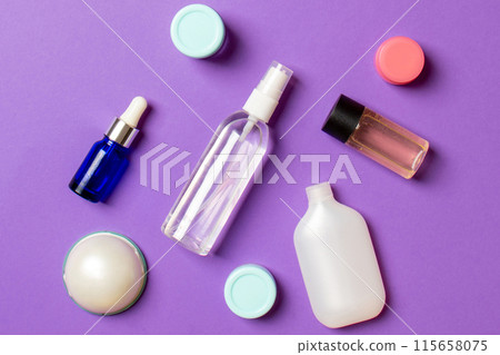 Cosmetics SPA branding mock-up, top view with copy space. set of tubes and jars of cream flat lay on colored background Cosmetics SPA branding mock-up, top view with copy space. set of tubes and jars of cream flat lay on colored background 115658075