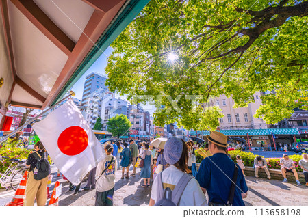 Tokyo cityscape in Japan: Hinomaru at police box... Asakusa station bustling with foreign tourists... = May 3, Golden Week 115658198