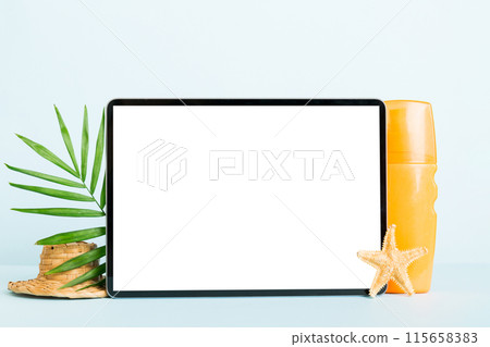 Flat lay composition with tablet and beach accessories on colored background. Tablet computer with blank screen mock up with copy space Flat lay composition with tablet and beach accessories on colored background. Tablet computer with blank screen mock up with copy space 115658383