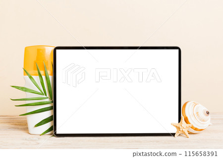 Flat lay composition with tablet and beach accessories on colored background. Tablet computer with blank screen mock up with copy space 115658391