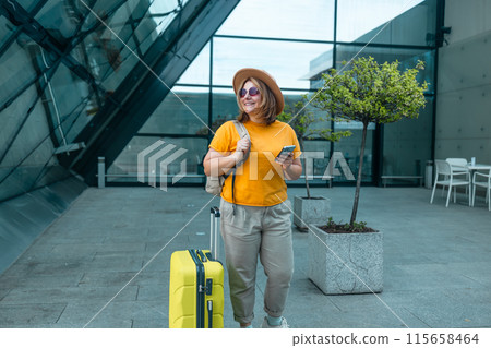 Young Caucasian female passenger in stylish casual clothes sit has training online meeting on laptop computer in airline lounge wait transit international airport. Young Caucasian female passenger in stylish casual clothes sit has training online meeting on laptop computer in airline lounge wait transit international airport. 115658464