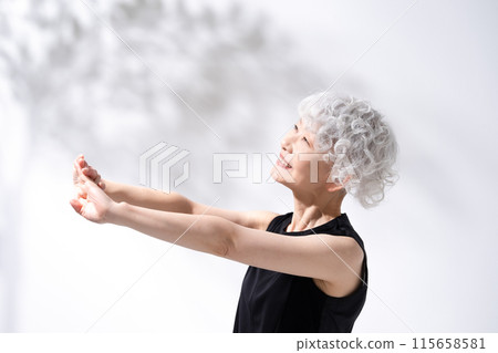 Stretching, stretching, gray hair woman 115658581