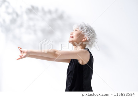 Stretching, stretching, gray hair woman 115658584