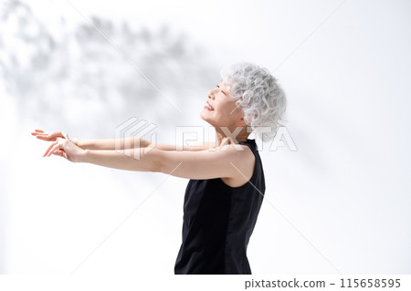 Stretching, stretching, gray hair woman 115658595