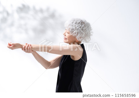 Stretching, stretching, gray hair woman 115658596