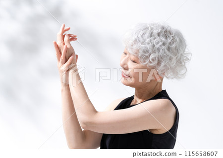 Stretching, stretching, gray hair woman 115658607