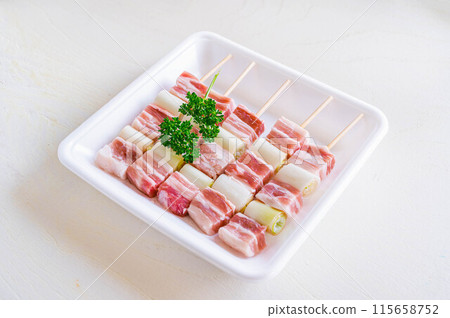 Pork belly skewer with green onions Pork belly skewer with green onions 115658752