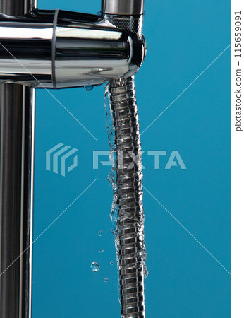 Shower head leak water from hoses plumbing in bathroom as water clogged drop. Blue bathroom background isolated. Leaking water from chromium stainless steel shower head Shower head leak water from hoses plumbing in bathroom as water clogged drop. Blue bathroom background isolated. Leaking water from chromium stainless steel shower head 115659091