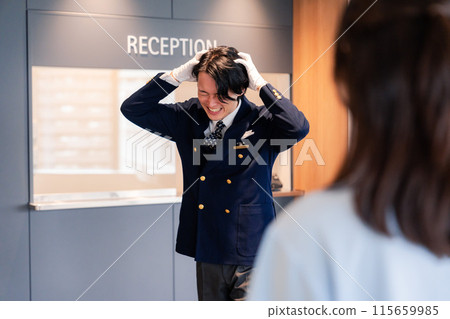 Hotel staff apologizing to customers Hotel staff apologizing to customers 115659985