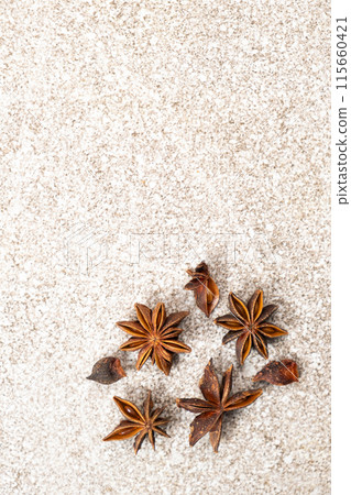 Spice star anise closeup on gray stone background, copy space for text Spice star anise closeup on gray stone background, copy space for text 115660421