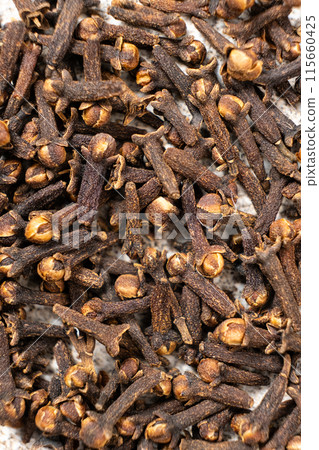 Dried clove spice, macro top view 115660425