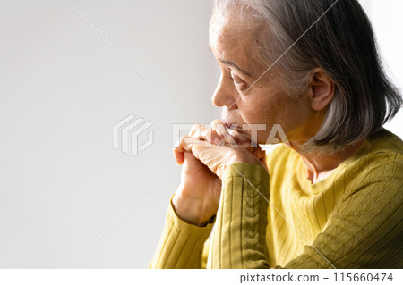 Senior woman worries 115660474
