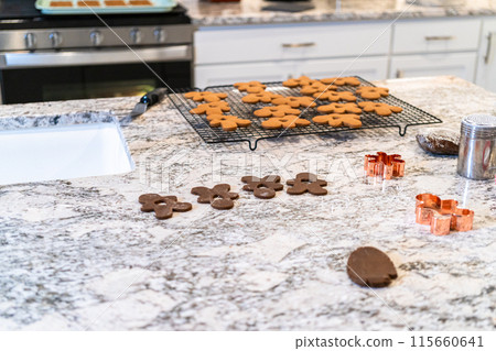 In a contemporary white kitchen, gingerbread cookie dough is skillful 115660641