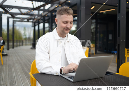 Homemade sourdough bread. Woman hands cuts the bread on cutting board. Handcrafted. Wooden cutting board.  115660717