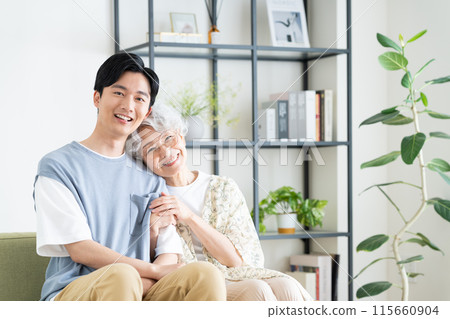 Grandmother and grandson relaxing in the living room 115660904