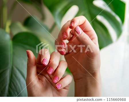 Hands with pink neon stamping nails manicure 115660988