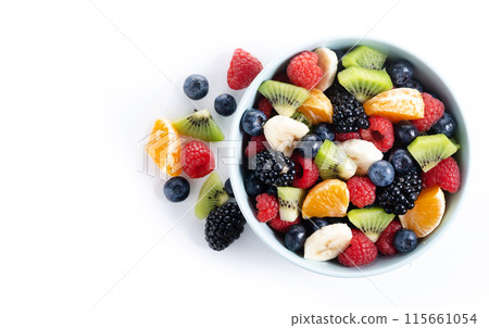 Fruit salad in a blue bowl isolated on white background 115661054