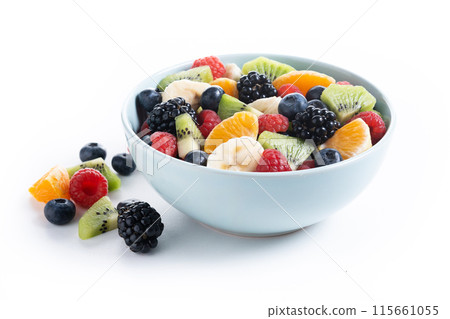 Fruit salad in a blue bowl isolated on white background Fruit salad in a blue bowl isolated on white background 115661055