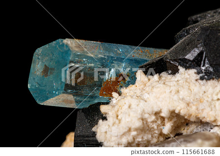 Macro stone mineral tourmaline aquamarine with a black background Macro stone mineral tourmaline aquamarine with a black background 115661688