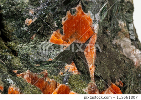 Macro stone mineral Diopside Calcite Magnetite on a white background Macro stone mineral Diopside Calcite Magnetite on a white background 115661807