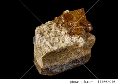 Macro stone Grossular mineral on a black background 115662016