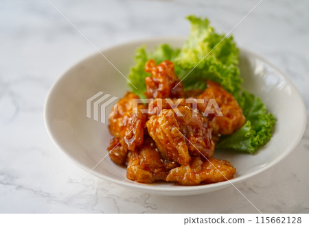 Close up delicious Chinese food menu, Three flavors pork tenderloin. The Chinese menu dish in on a white marble table with natural light. Close up delicious Chinese food menu, Three flavors pork tenderloin. The Chinese menu dish in on a white marble table with natural light. 115662128