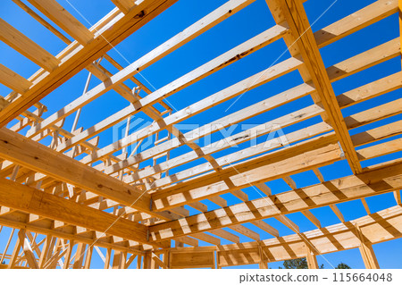 During construction of new home, ceiling roof trusses framework beams rafters were installed 115664048