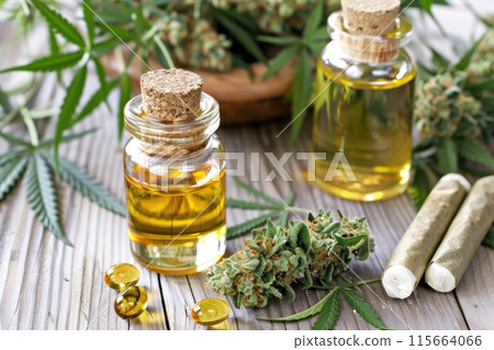 Marijuana buds with marijuana joints and cannabis oil. 115664066