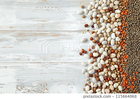Mixed dry beans on white wooden board from above. Space for text. 115664068