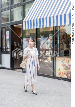 A woman enjoying shopping in a happy mood 115664520