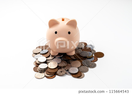 Image of a calculator and stacks of coins on a white background Image of a calculator and stacks of coins on a white background 115664543