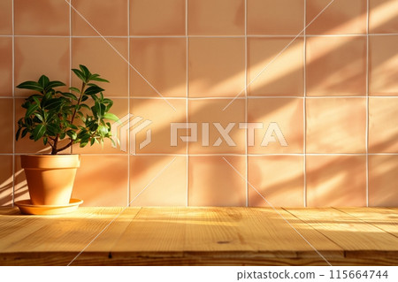 Peach tiled wall with wooden countertop, featuring a potted plant and soft sunlight Peach tiled wall with wooden countertop, featuring a potted plant and soft sunlight 115664744