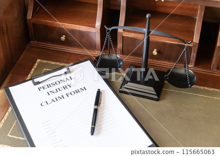 Legal Personal Injury Claim Form with Scales of Justice. 115665063